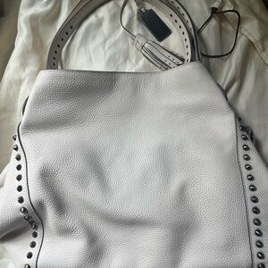 Coach chalk white Edie purse with studs and center zippered compartment